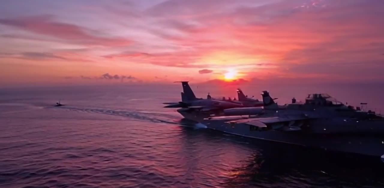 多艘航空母舰在海面上航行，其中一艘航母上有战斗机。